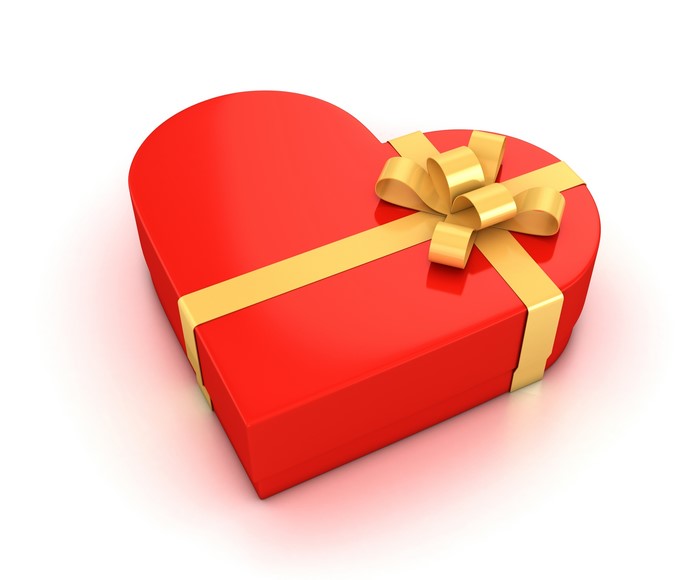 Red heart-shaped gift box with gold ribbon and bow