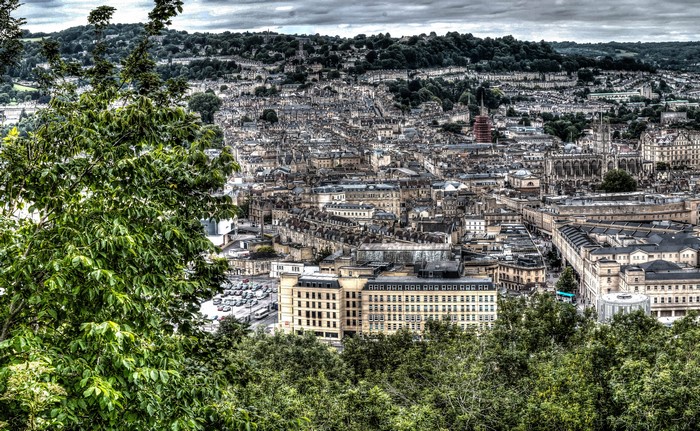 Cityscape of Bath, England with trees in foreground