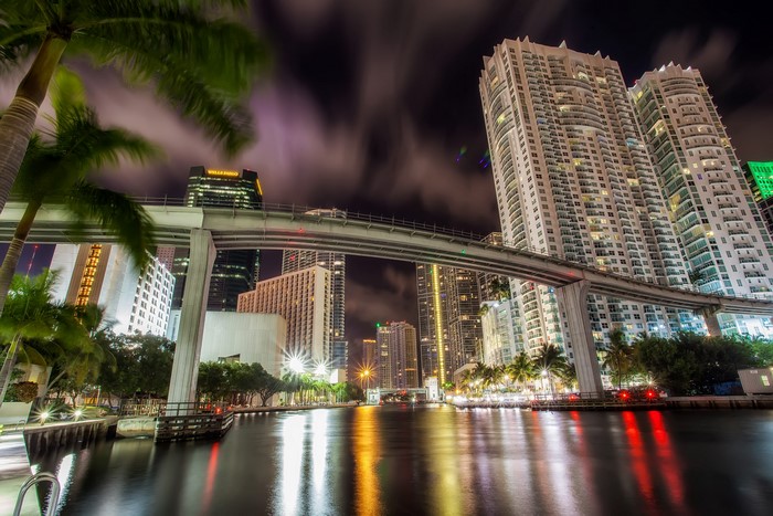 Miami Nighttime Canal with Bridge and Skyscrapers