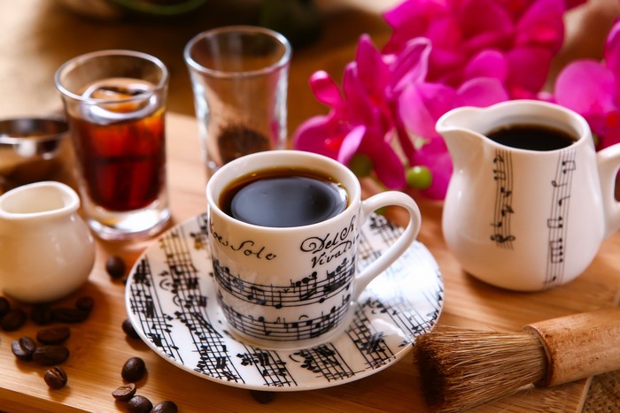 Coffee cup and saucer with musical notes