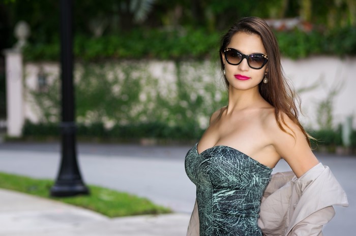 Woman with sunglasses and a dress