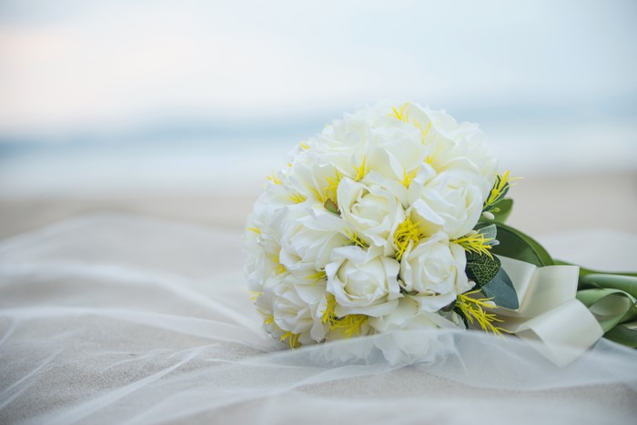 White Roses Bouquet on Beach with Veil