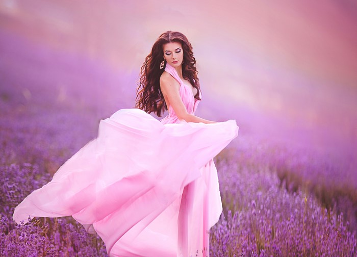 Woman in pink dress in lavender field