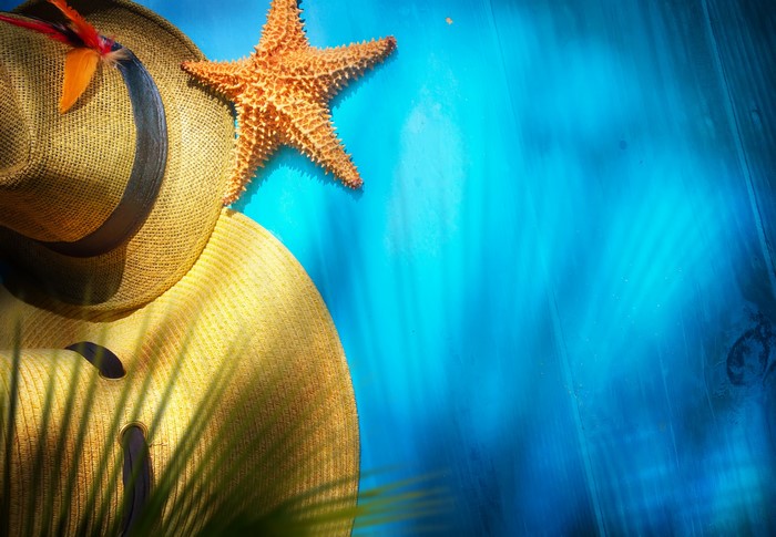Starfish and Hats on Blue Background