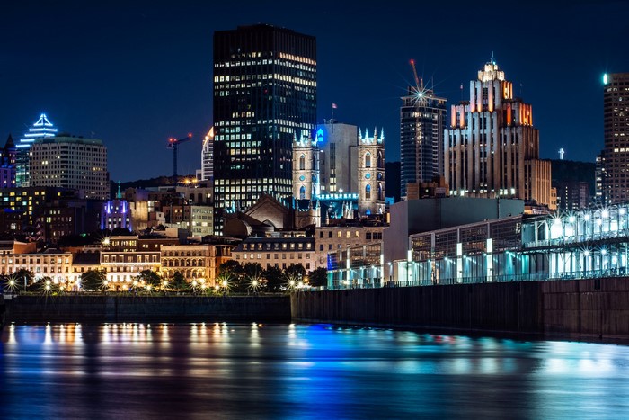 Montreal skyline at night with river reflections