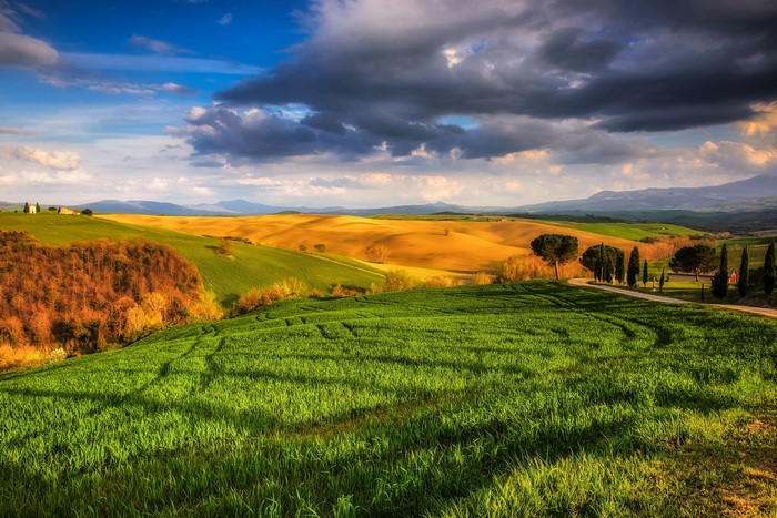 Tuscany landscape with rolling hills and dramatic clouds