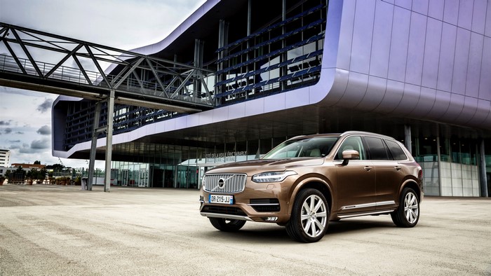 2015 Volvo XC90 D5 parked in front of a modern building