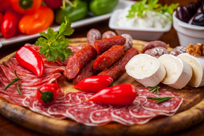 Sausage and cheese platter with bell peppers