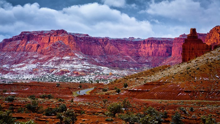 Red rock canyon with snow and road, USA