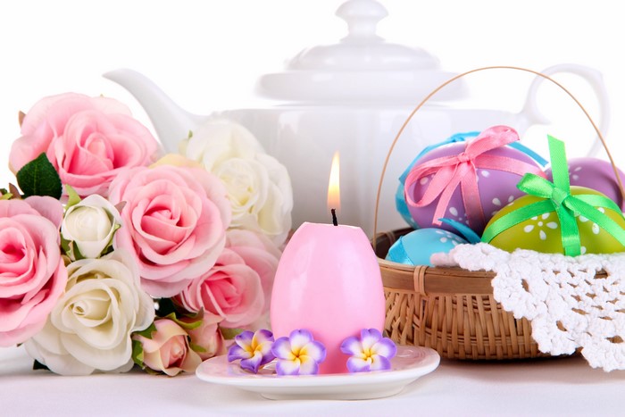 Easter eggs, candle, roses, and teapot