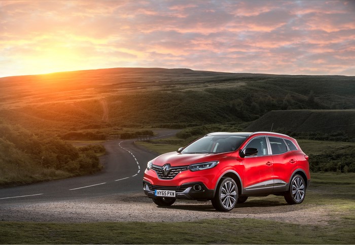 Red Renault Kadjar dCi 130 on a country road at sunset