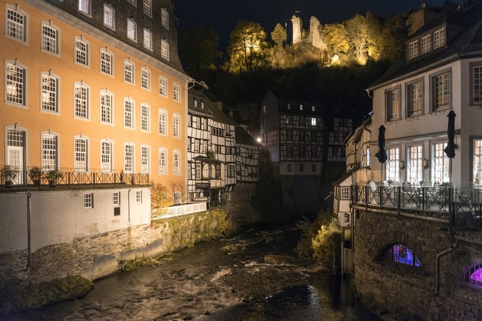 Monschau, Germany at Night with River and Castle Ruins