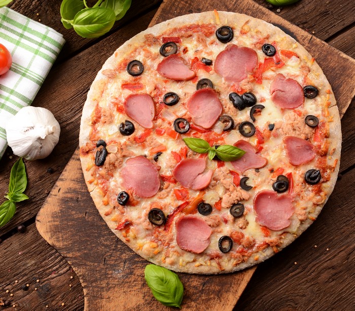Pizza with Sausage, Olives, and Basil