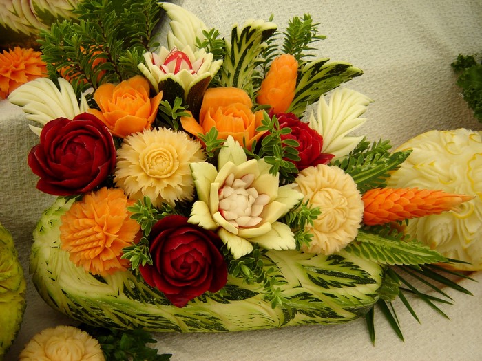 Carved vegetables arranged in a floral design