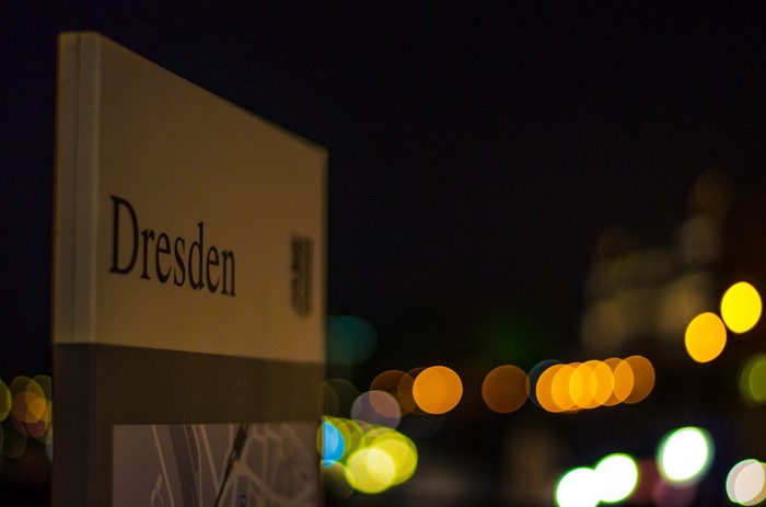 Dresden sign at night with bokeh lights