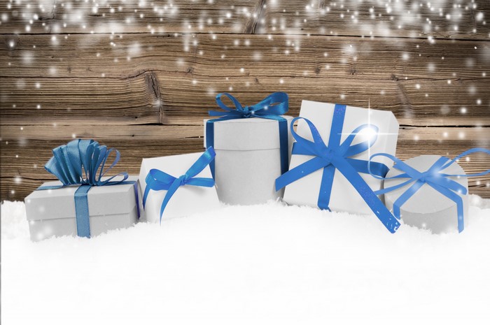 Gifts with blue bows in the snow