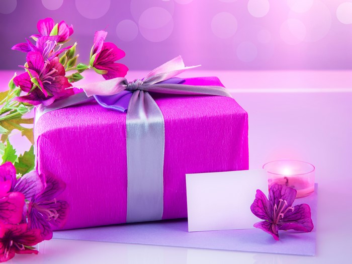 Gift box with flowers and candle