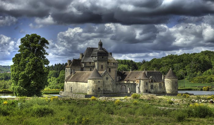 Chateau du Theret in La Sauniere, France under dramatic clouds