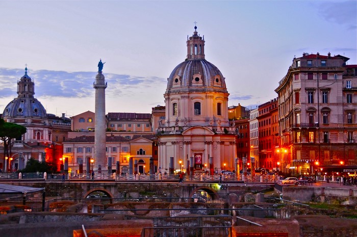 Evening view of Trajan's Column and churches in Rome