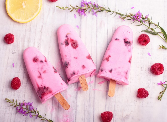 Three Raspberry Ice Cream Bars with Lemon and Flowers