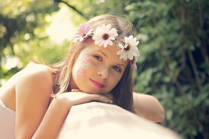 Little girl with flower crown and face paint