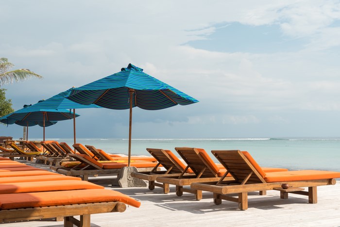 Beach with sunloungers and umbrellas