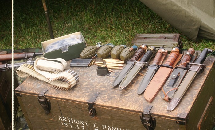 Collection of military knives and ammunition
