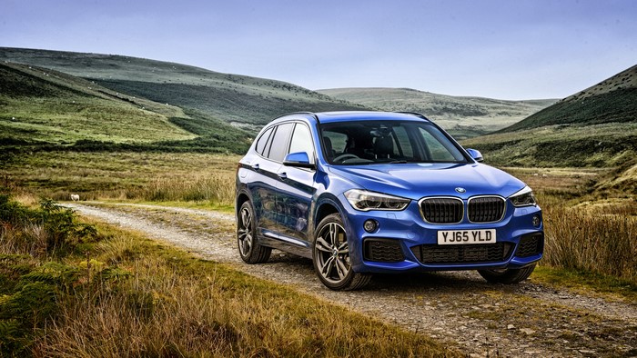 Blue 2015 BMW X1 M xDrive F48 on a dirt road
