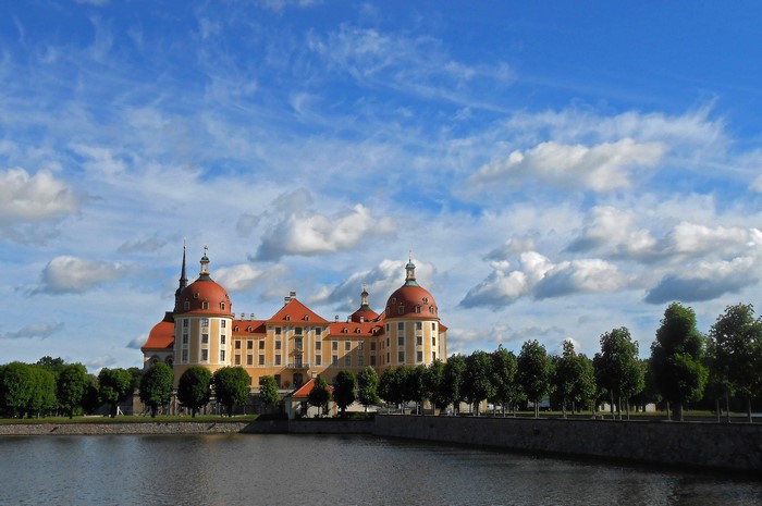Moritzburg Castle in Germany under a cloudy sky
