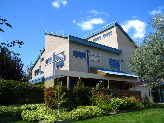 Modern house with garden and blue roof