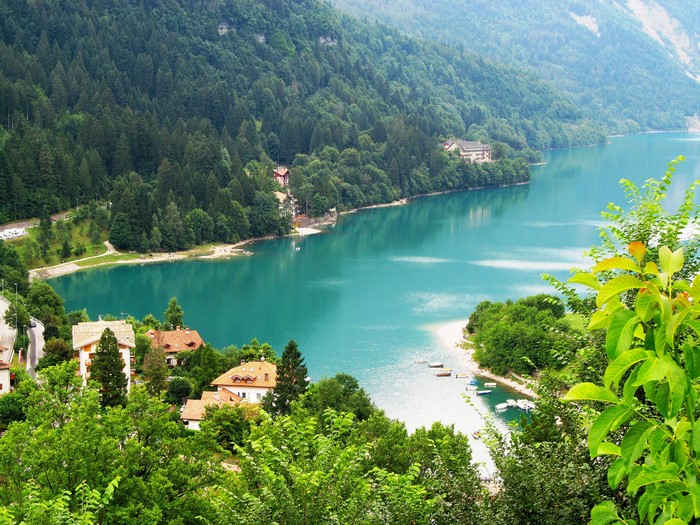 Lake Molveno with houses and forest in Italy