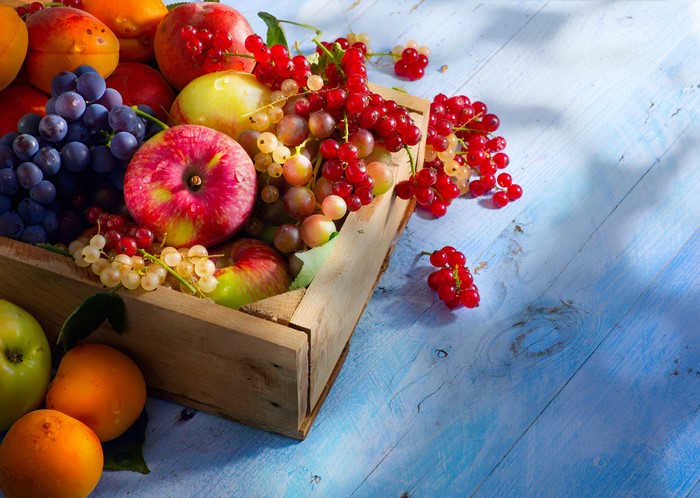 Fruit in a wooden crate: Apples, Grapes, Currants