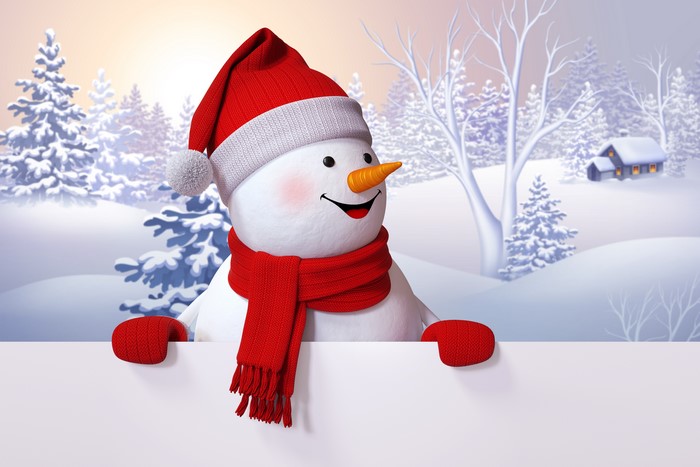 Snowman with red hat and scarf in winter landscape