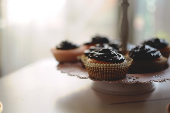Cupcakes with chocolate frosting on a tiered stand