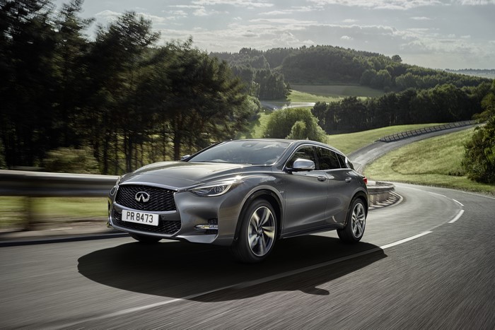 Infiniti Q30 driving on a winding road