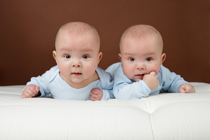 Two Infants Lying Down