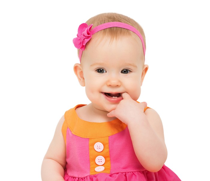 Baby girl with pink headband and dress