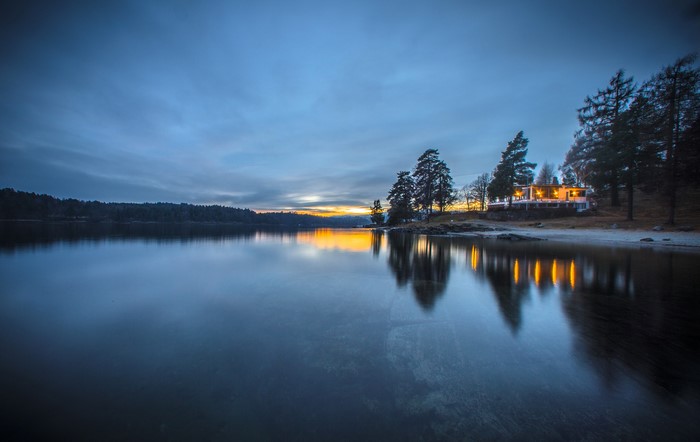 House on a lake at dusk in Norway