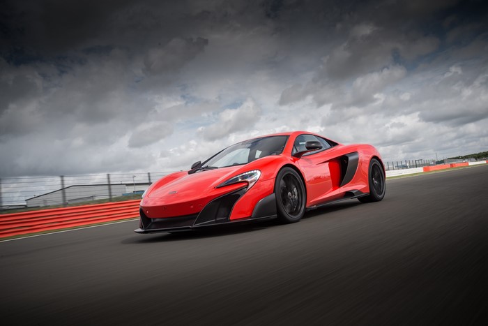 Red McLaren 675LT on a Racetrack