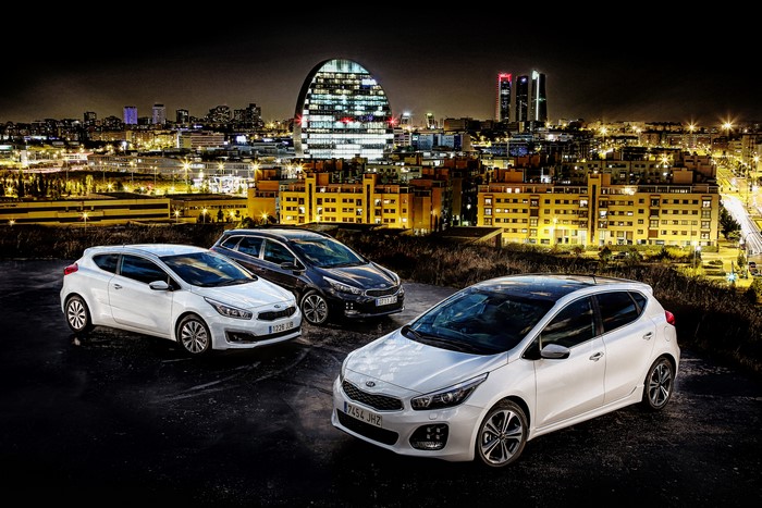 KIA cee'd cars at night in a city