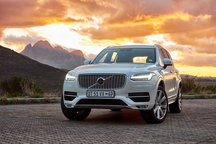 White Volvo XC90 T6 Momentum parked at sunset