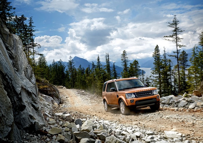 Land Rover Discovery driving on a rocky mountain road