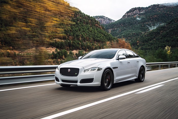 2015 Jaguar XJR driving on a mountain road