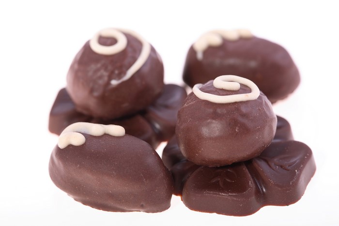 Assortment of chocolate candies with white icing