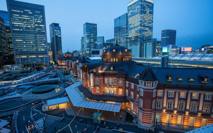 Tokyo Station at dusk with modern skyscrapers