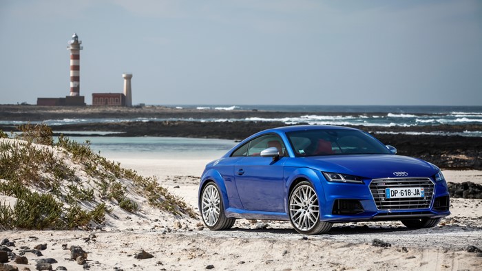 Blue Audi TTS Coupe on a Beach with Lighthouses