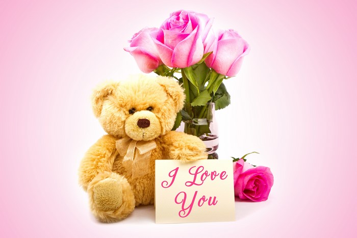 Teddy bear with pink roses and "I Love You" card