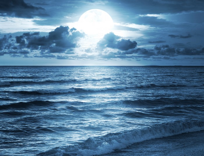 Full Moon Over the Ocean Horizon