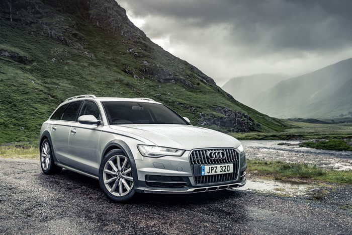 Silver Audi A6 Avant quattro estate car in a mountainous landscape