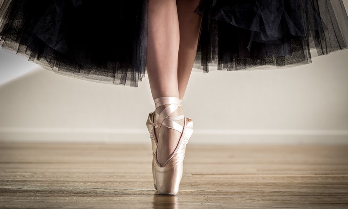 Ballet dancer in pointe shoes and black tutu